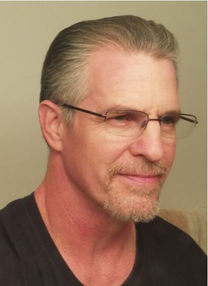 Ken E.
